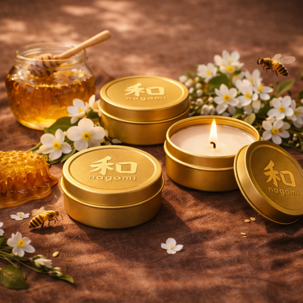 Nagomi Floral Honey Harmony candles–1½ oz gold tins, lit, –honey jasmine floral scent