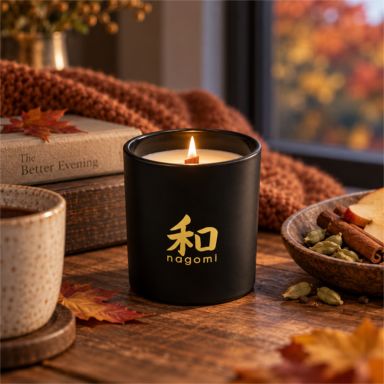 Autumn’s Sigh candle lit on a warm autumn evening with apple, cardamom and fall accents