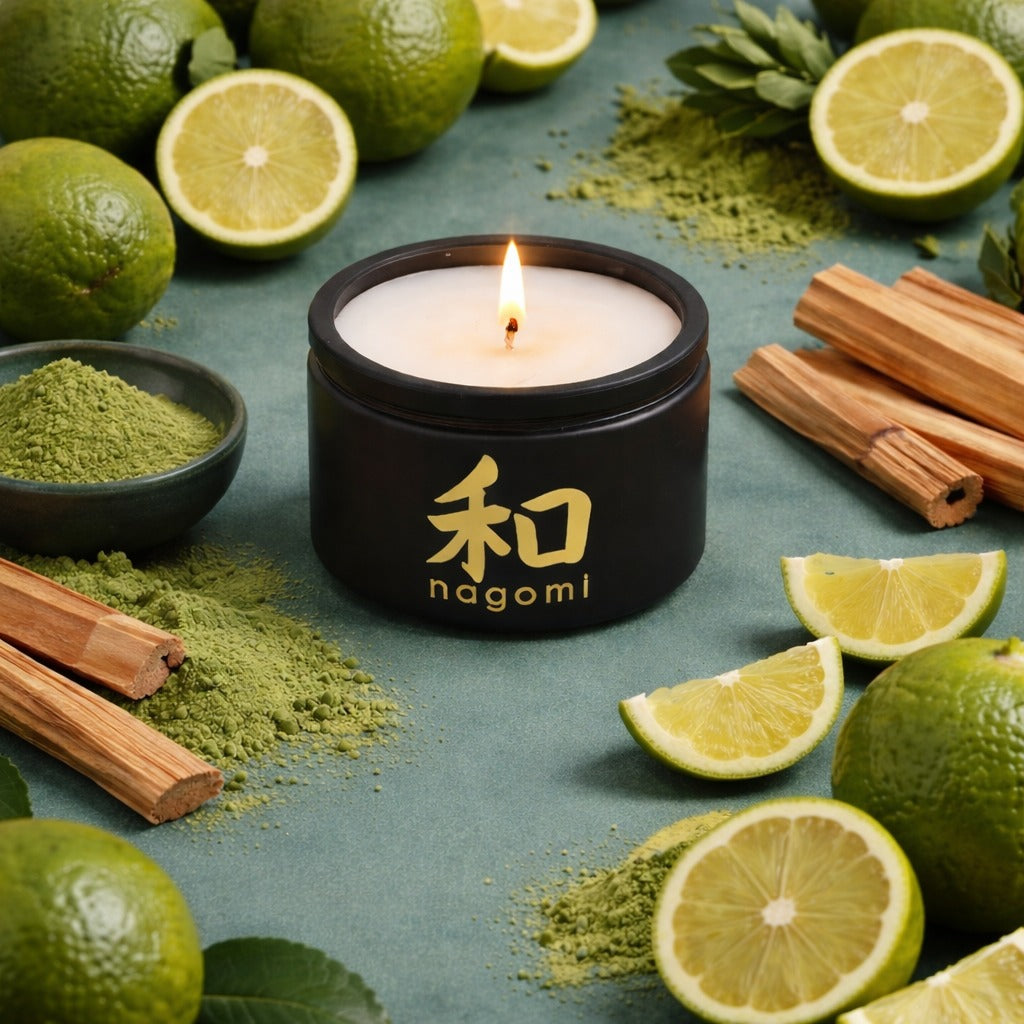 Four-ounce Nagomi Aromatic Journey candle in a black glass jar, lit, on a neutral background with bergamot, matcha, and sandalwood.