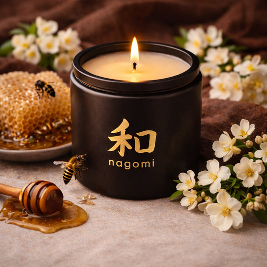 Nagomi Floral Honey Harmony candle – 12 oz black glass jar, lit, – honey jasmine floral scent