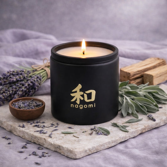 Nagomi Herbal Harmony candle – 8 oz black glass jar, lit, – lavender, sage, cedarwood 