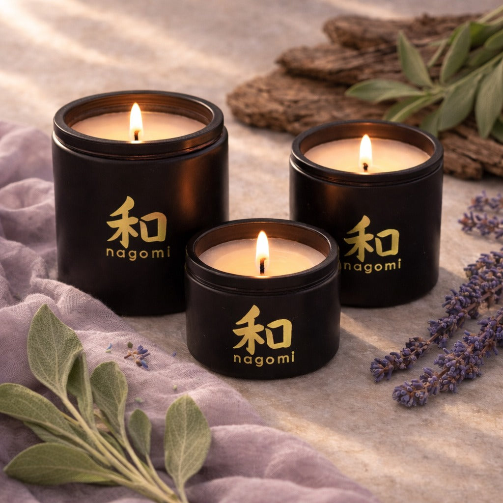 3 Nagomi Herbal Harmony candles – black glass jars, lit, – lavender, sage, cedarwood scent