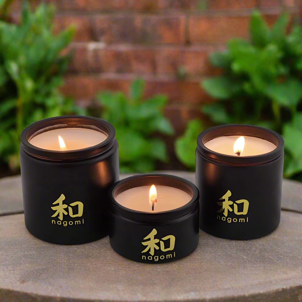 3 luxury scented candles in a garden | Nagomi Candles